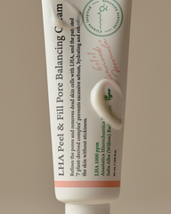 Tube of LHA Peel & Fill Pore Balancing Cream with branding on a beige background