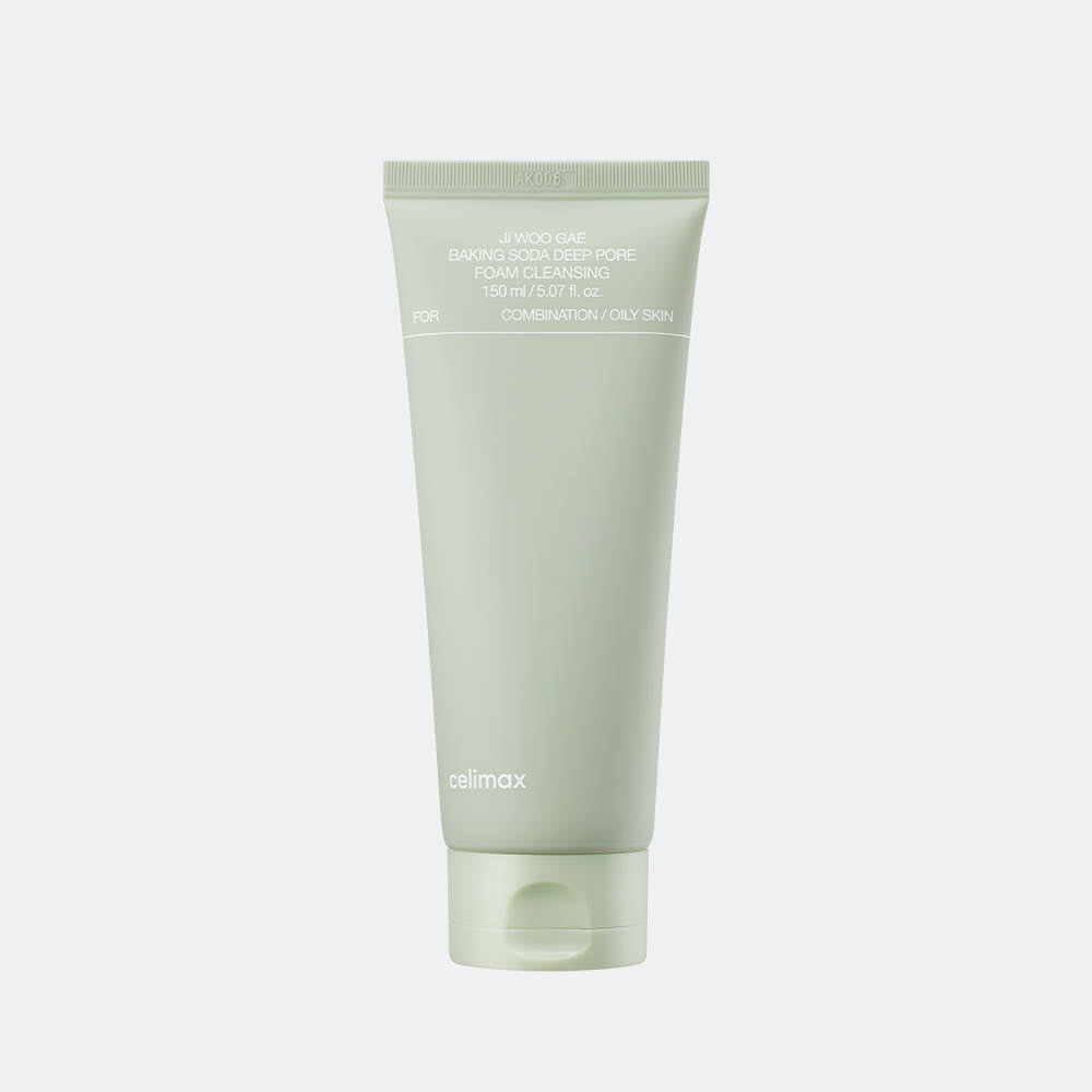 Green tube of skincare product on a light gray background