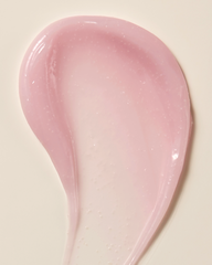 Pink ceramic spoon on a beige background