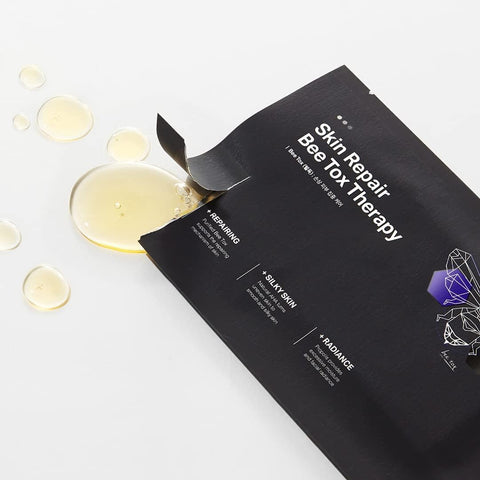 Skin repair mask with oil droplets on a white background