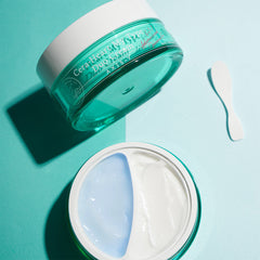 Jar of Cera-Healix Bio Repair Cream with a white applicator on a teal background