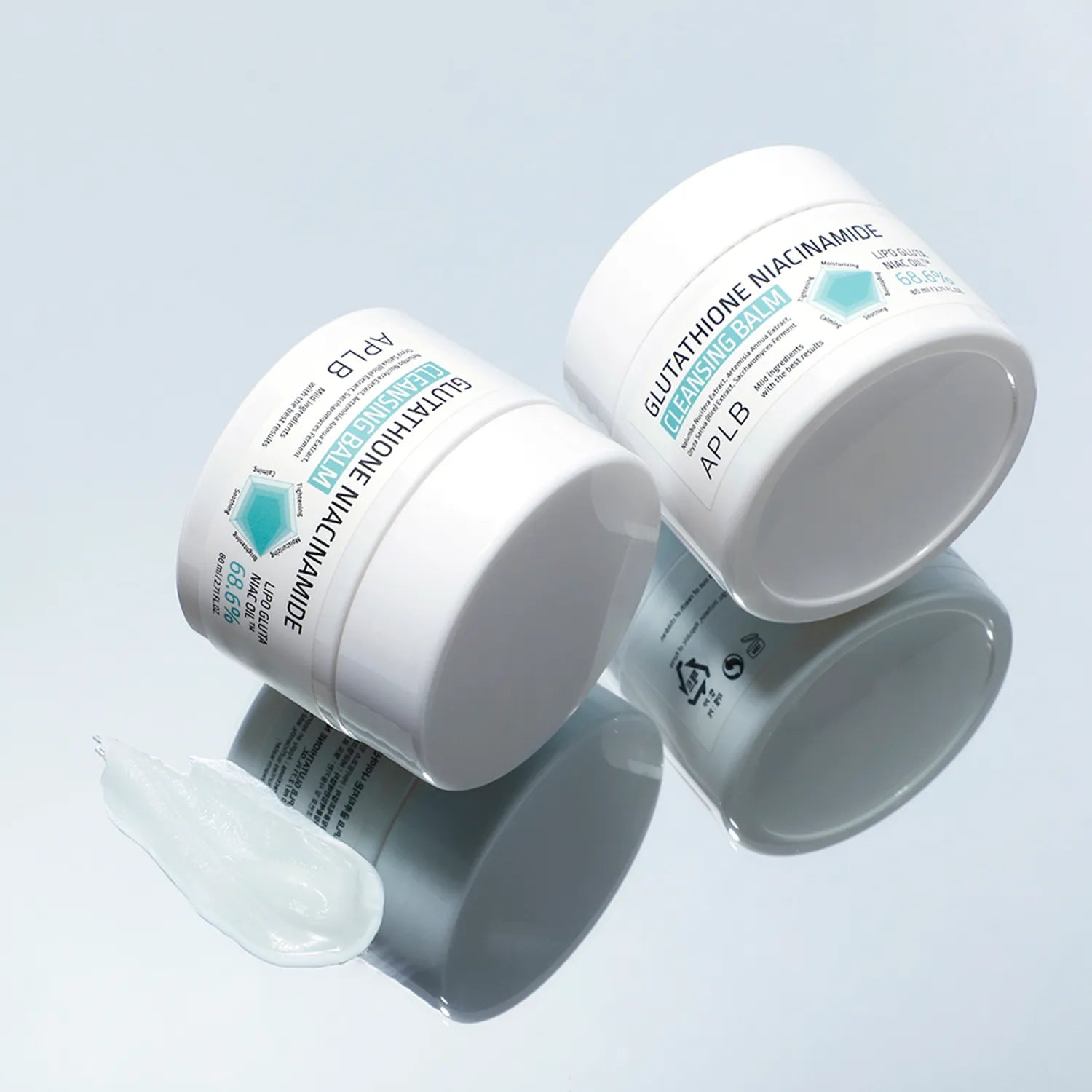 Two white cosmetic jars with labels on a light blue background