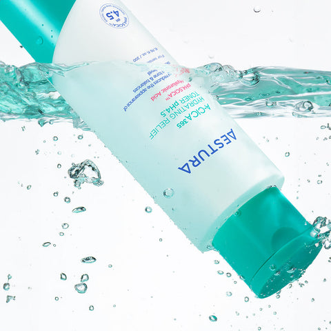 Aestura skincare product with water droplets and bubbles