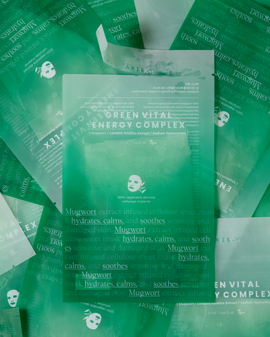 Green facial mask packets with text on a green background