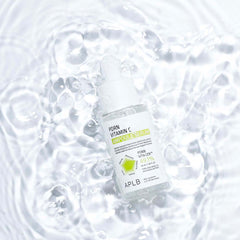 APLB vitamin C ampoule serum bottle on water surface