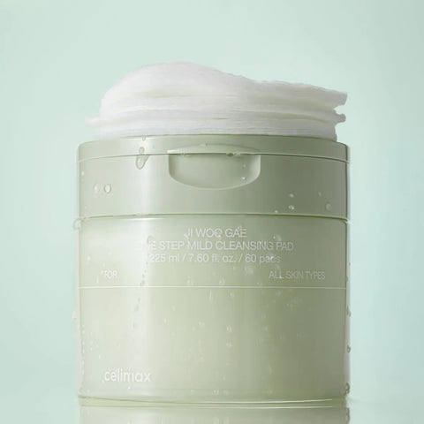 Cleansing pad container with white lid on a light green background