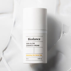 Biodance Skin-Glow Essence Cream container on a textured white background
