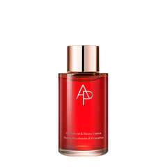 Red bottle with a rose gold cap on a white background