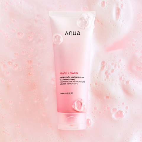 Anua cleansing foam tube on a pink bubble background