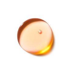 Amber-colored droplet on a white background