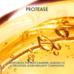 Close-up of a skincare product with droplets and the brand 'PROTEASE' displayed.