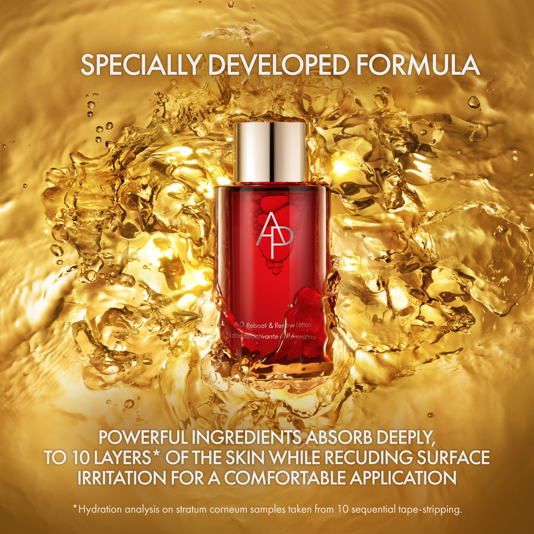 Red skincare serum bottle with gold liquid splash and text about its formula.