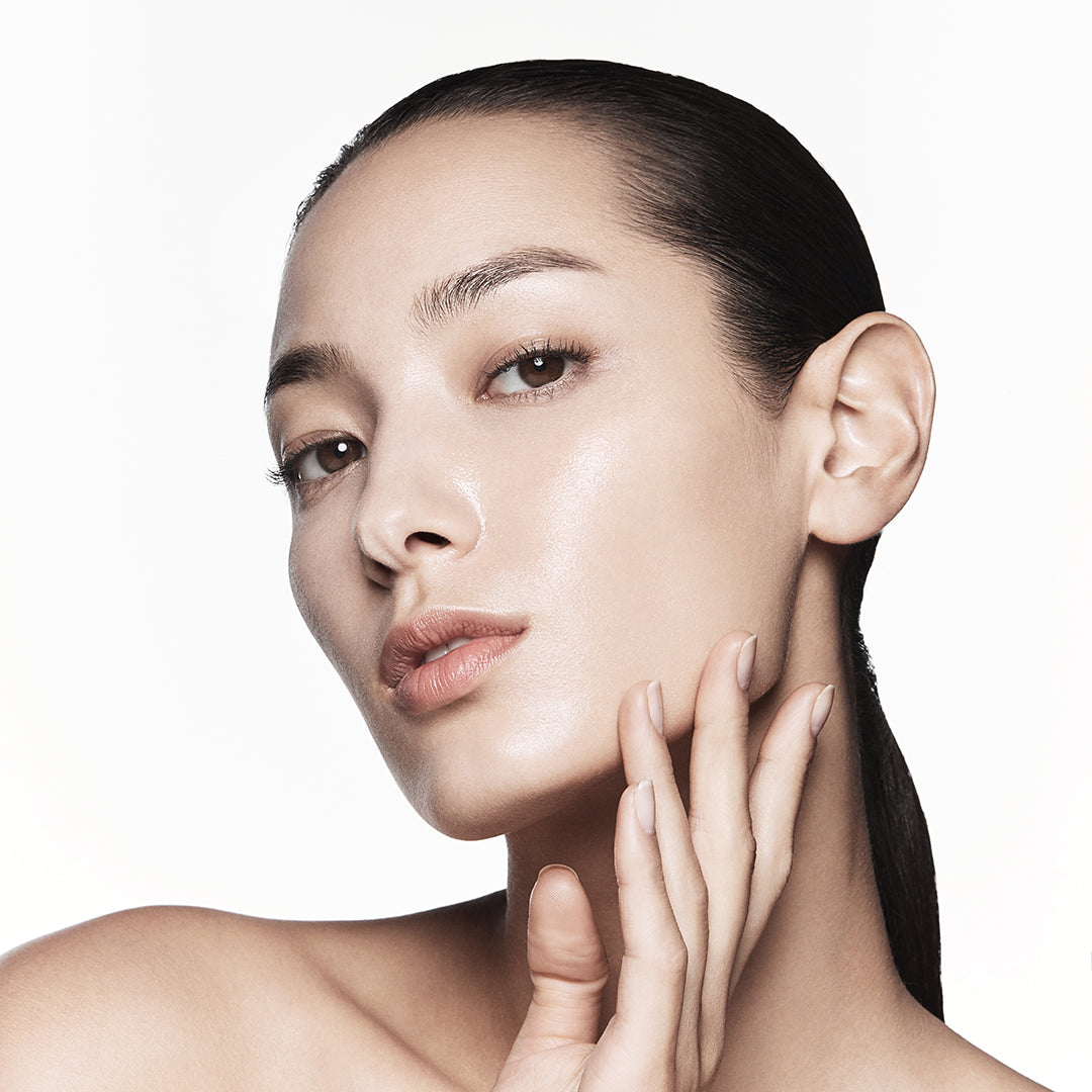 Close-up of a woman's face with a neutral background