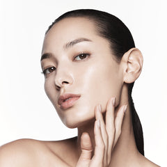 Close-up of a woman's face with a neutral background