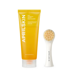 AprilSkin foam cleanser tube and facial cleansing brush on a white background