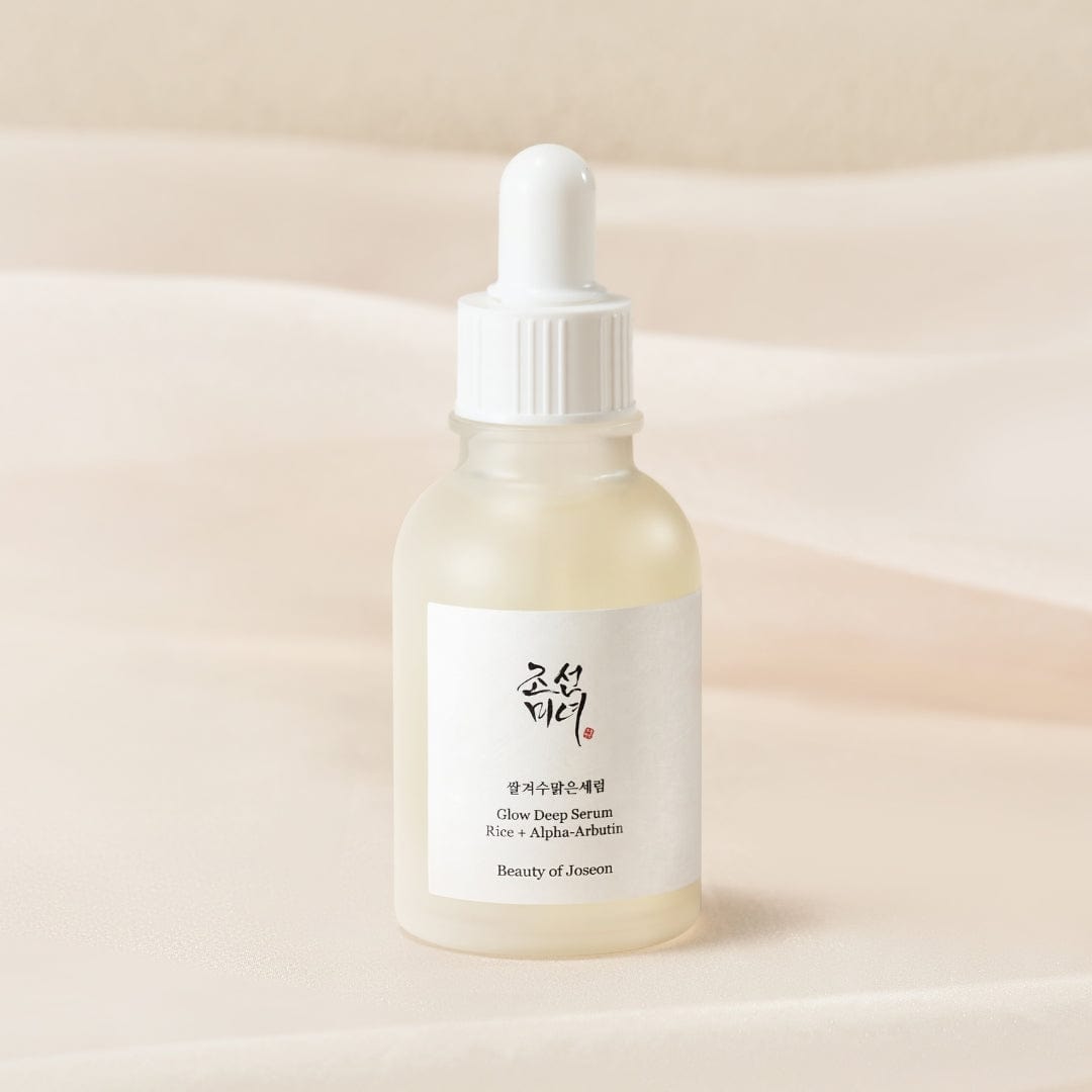 Skincare serum bottle with dropper on a beige background