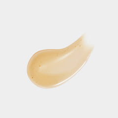Close-up of a beige cream swatch on a light gray background
