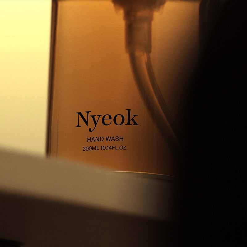Nyeok hand wash bottle with label in a warm glow