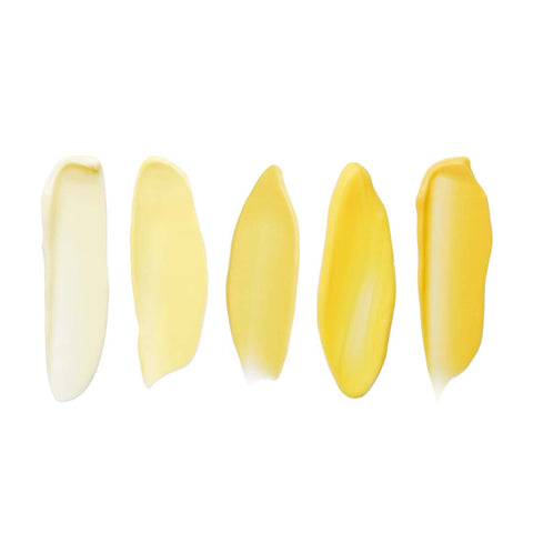 Set of five yellow nail tips on a white background