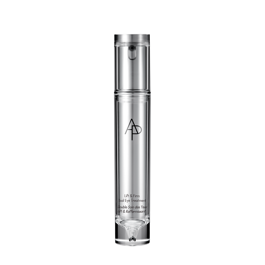 Skincare bottle with silver cap and black text on a white background