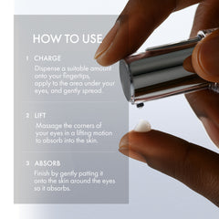 Hand holding a skincare product with usage instructions on a light gray background