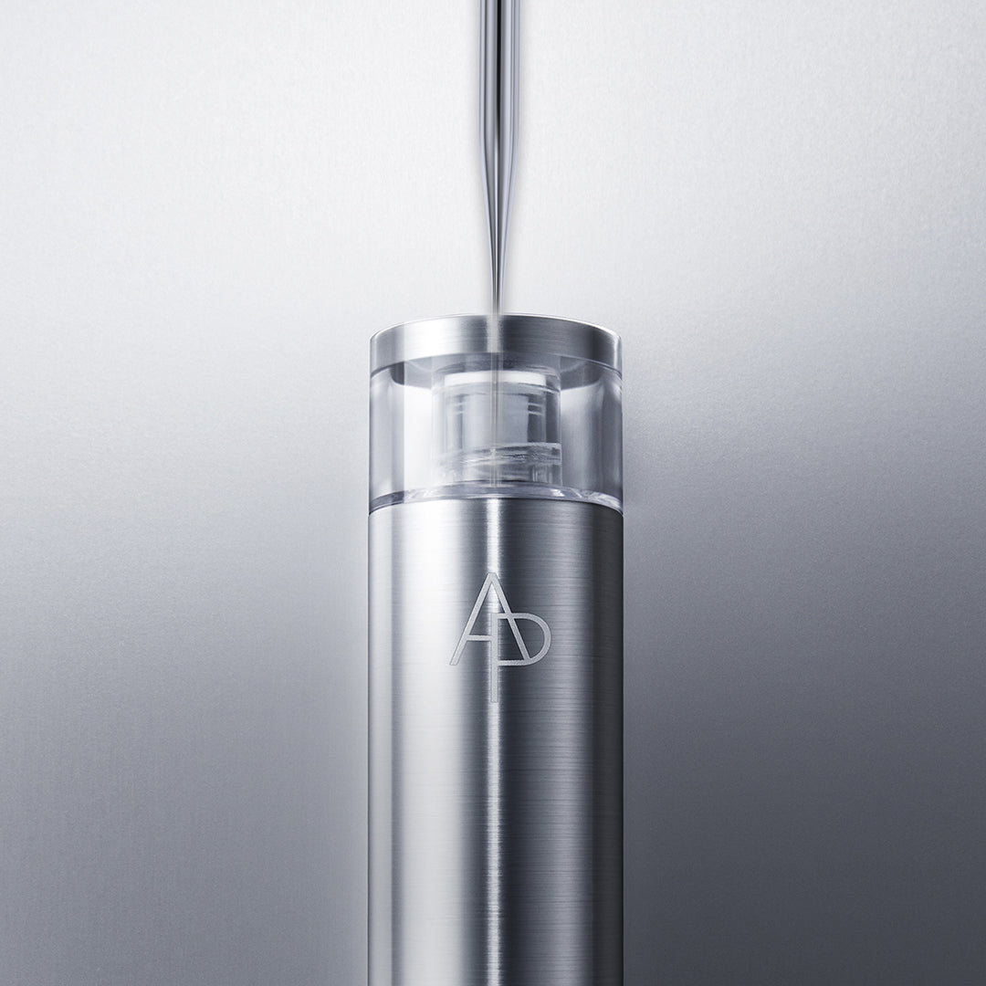 Stainless steel water bottle with a logo on a light gray background