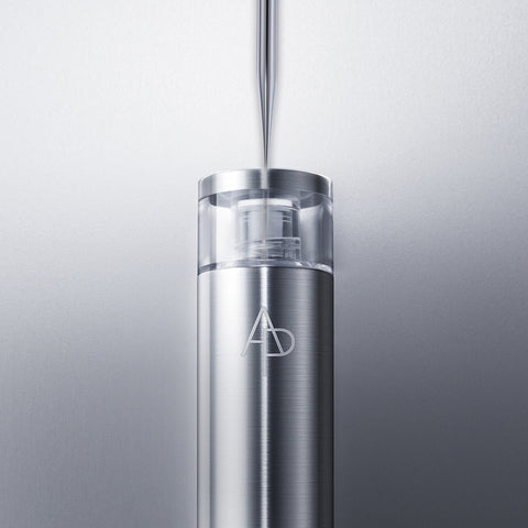 Stainless steel water bottle with a logo on a light gray background
