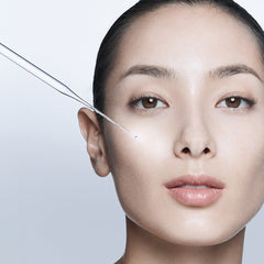 Woman with a clear background and a close-up of her face.