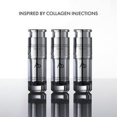 Three silver skincare bottles with a reflective surface on a white background, labeled 'Inspired by Collagen Injections'.