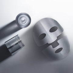 Skincare products including a mask, bottle, and jar on a light gray background
