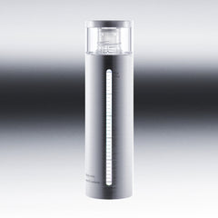 Silver skincare bottle with gradient background