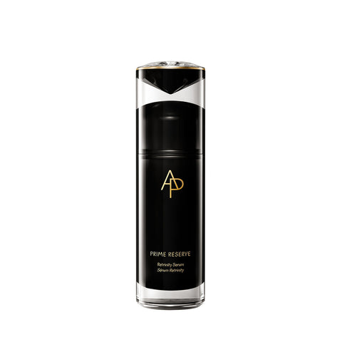Black skincare serum bottle with gold logo on a white background