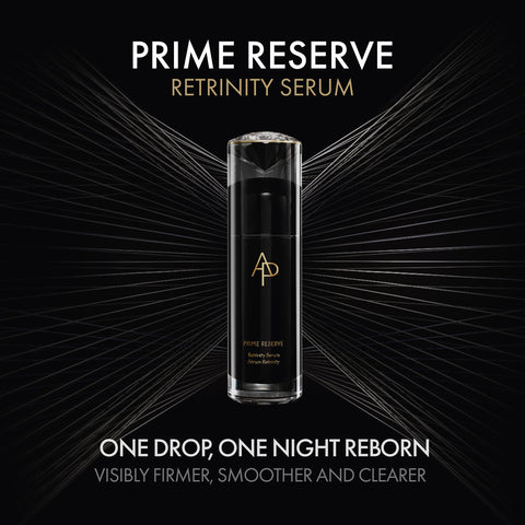 Prime Reserve Retrinity Serum bottle on a black background with gold accents