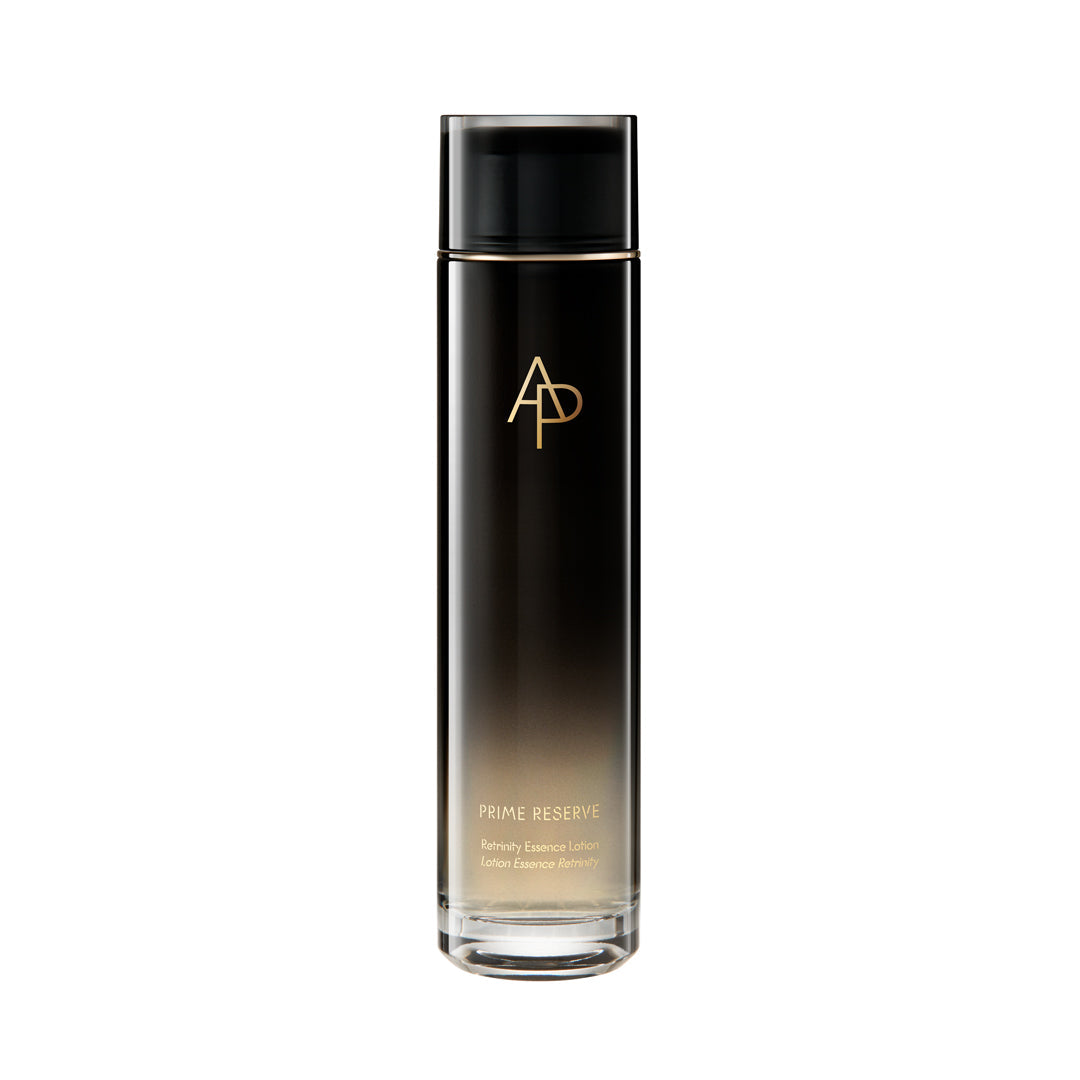 Black skincare bottle with gold logo and text on a white background