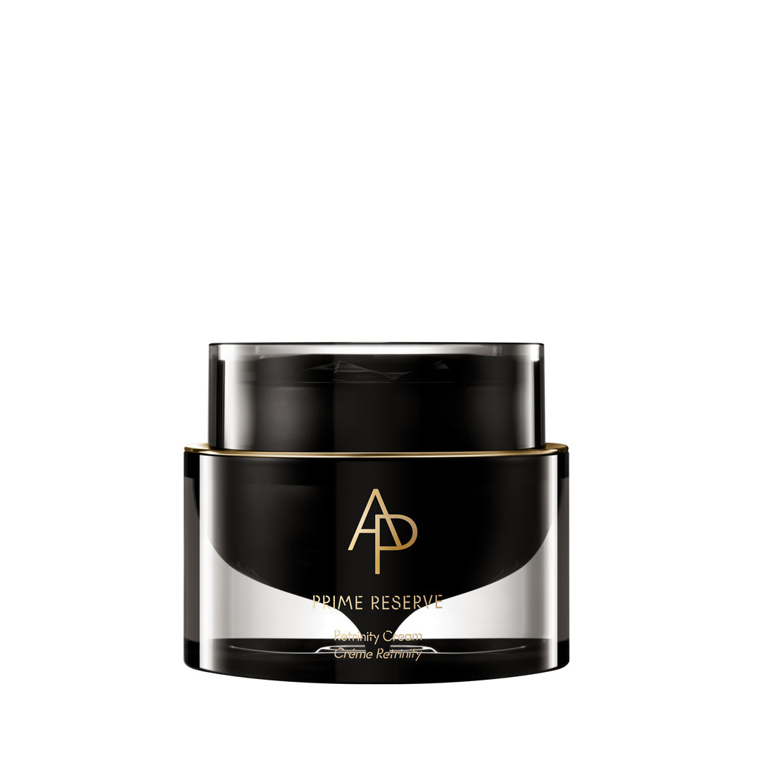 Black and gold jar of skincare product on a white background