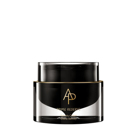 Black and gold jar of skincare product on a white background