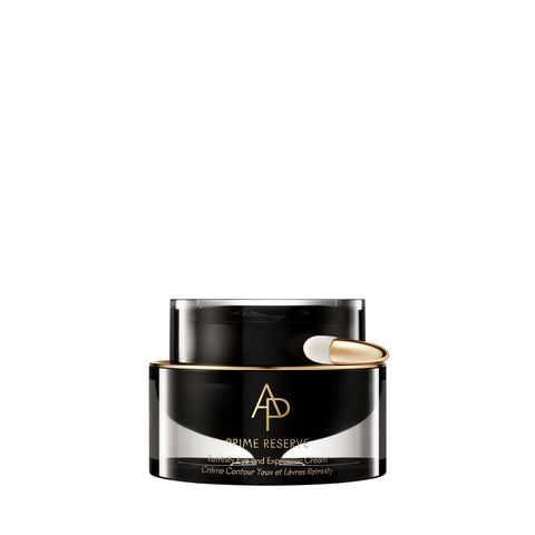 Black cosmetic jar with gold cap on a white background
