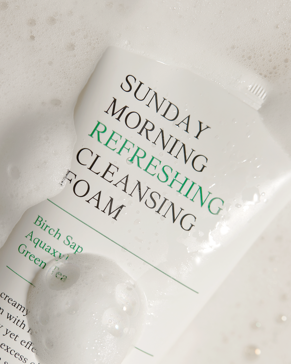 Packaging of 'Sunday Morning Refreshing Cleansing Foam' with text on a white background