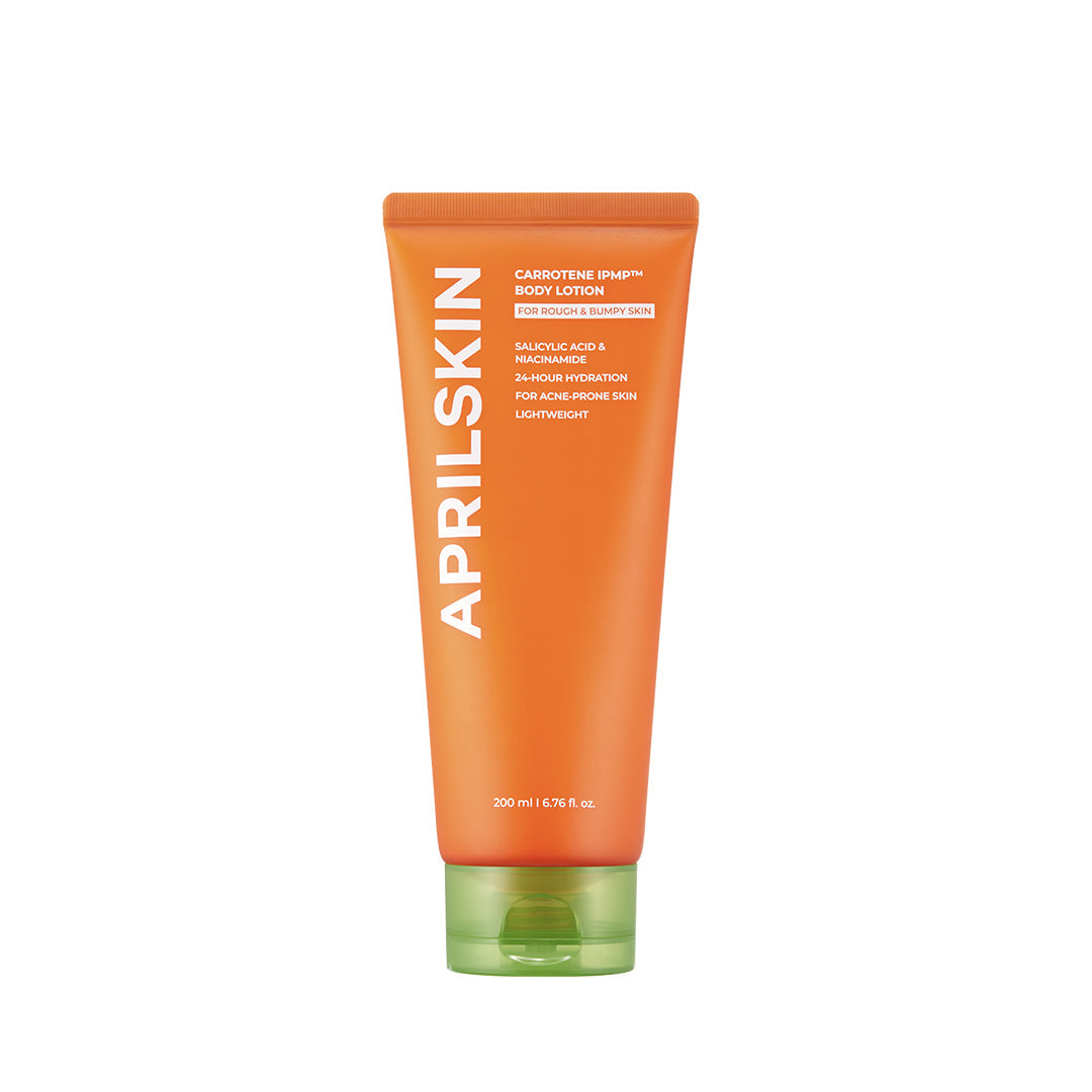 Orange AprilSkin body lotion tube on a white background