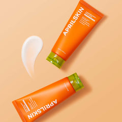 Two tubes of April Skin cream on a beige background
