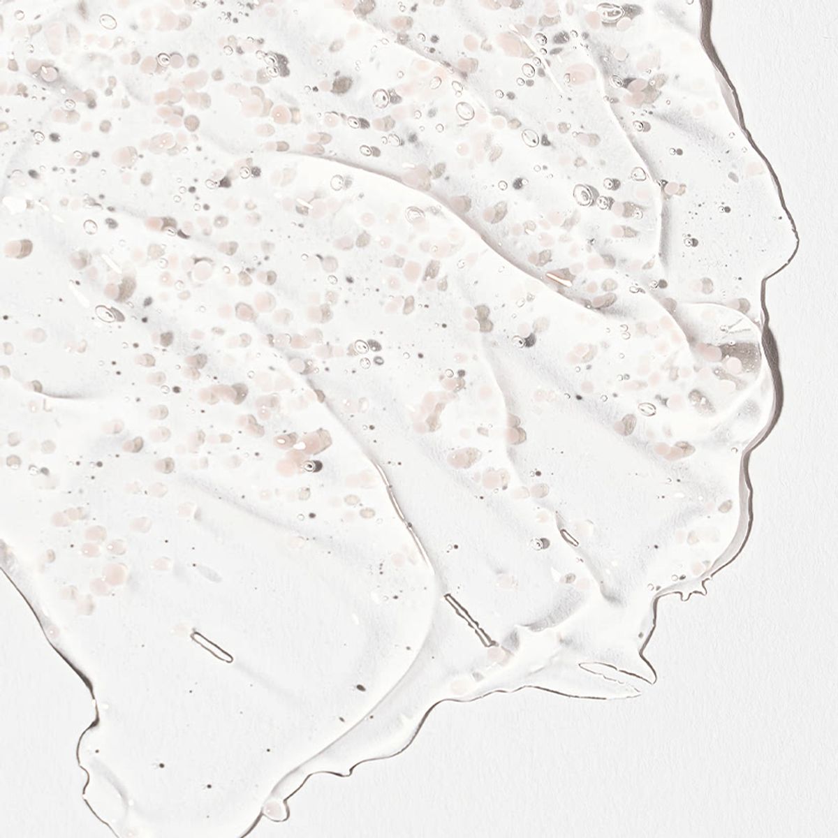 Close-up of a textured white surface with small particles