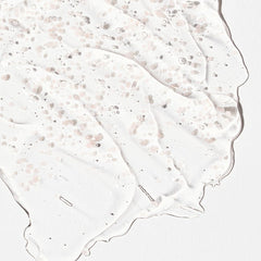 Close-up of a textured white surface with small particles