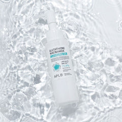 Skincare bottle with label on a textured white background