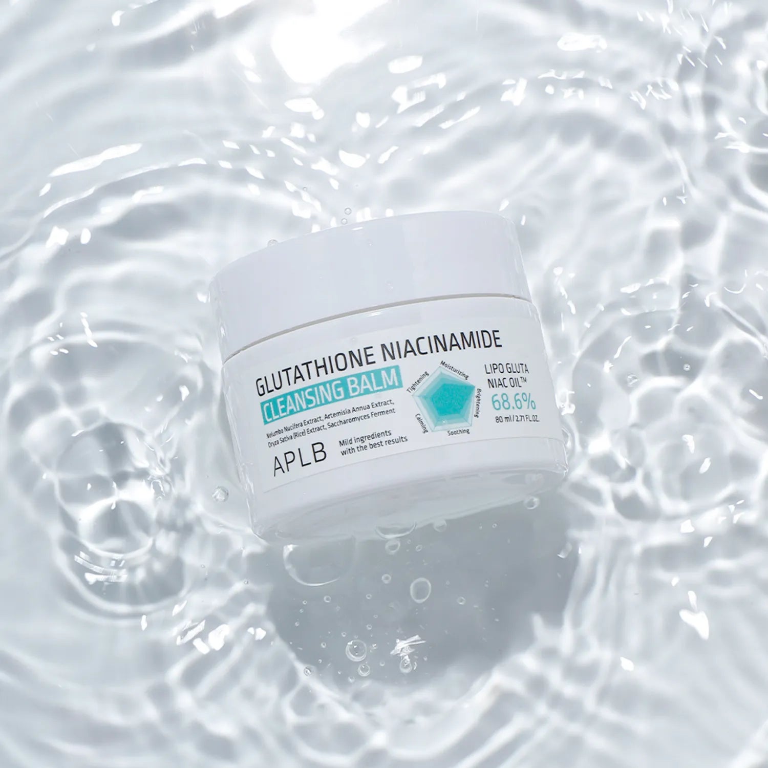 Cleansing balm container with 'APLB' branding on a water background