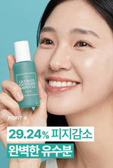 Woman holding a bottle of Licorice Soothing Ampoule with a blue background