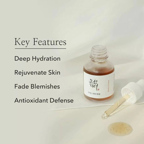 Skincare serum bottle with dropper on a light background, featuring key features text.