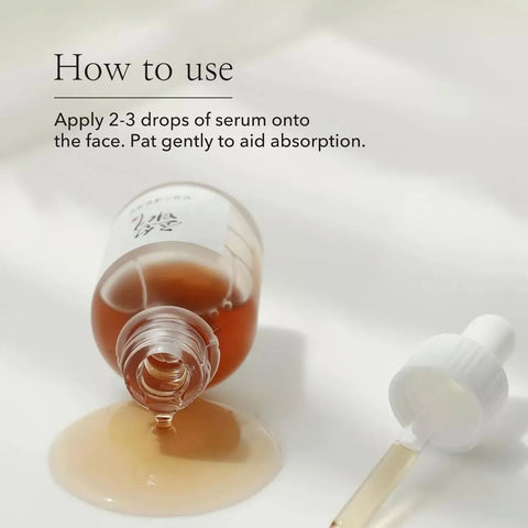 Serum bottle with dropper and text on how to use it on a white background