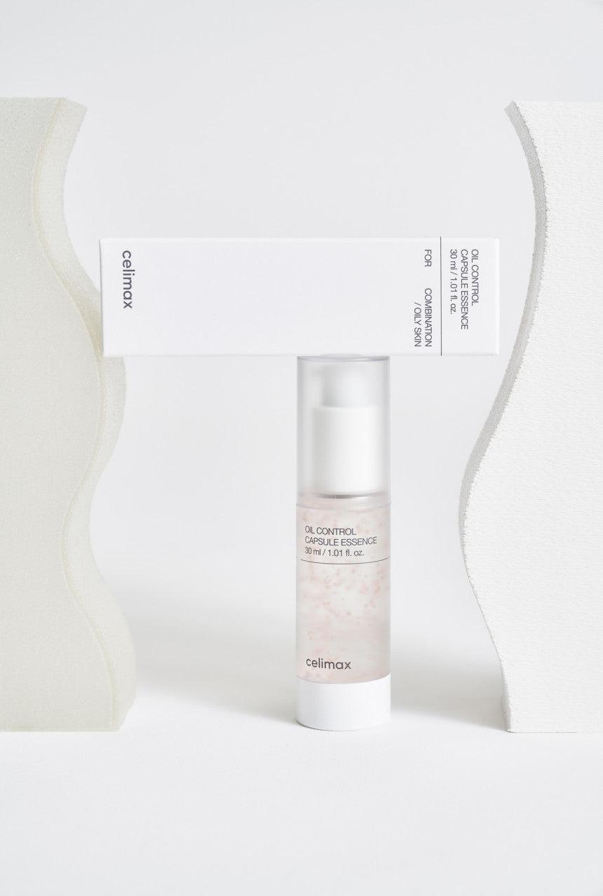 Skincare bottle with packaging on a white background