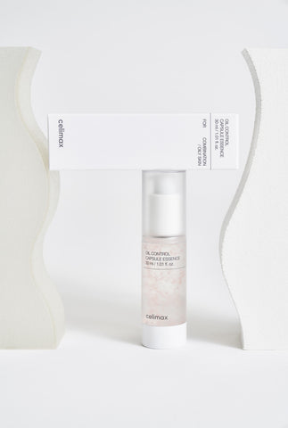 Skincare bottle with packaging on a white background
