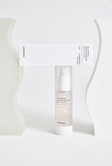 Skincare bottle with packaging on a white background